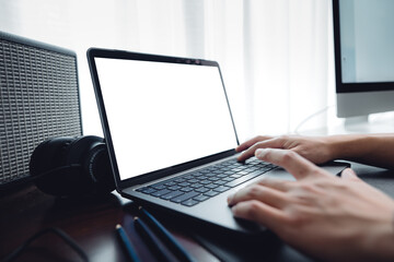 hands working on a laptop computer