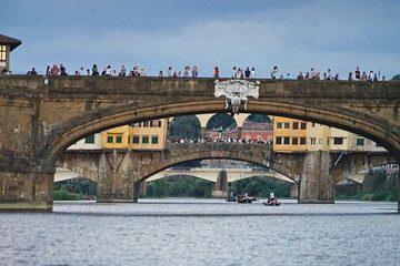 Bridges on the Arno river seen by a boat in Florence, Tuscany, Italy