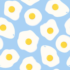 Seamless pattern of fried eggs on a blue background
