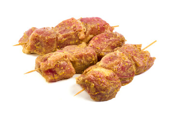 Raw pork skewers, ready to cook, kebab BBQ, isolated on white background.