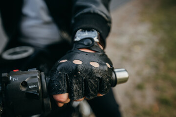 close up of a person holding a moto