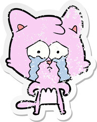 Obraz na płótnie Canvas distressed sticker of a cartoon crying cat