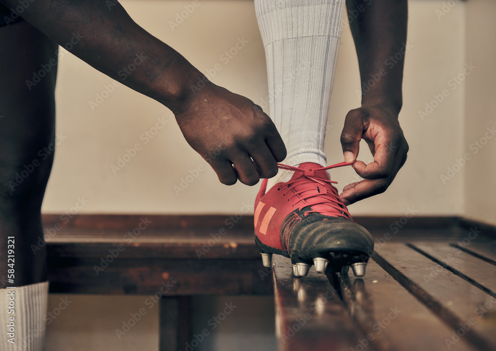 Wall mural Rugby, tie shoes or hands of man ready to start playing a training game for exercise or workout. Zoom, fitness or Healthy athlete player with footwear or boots in changing room or sports club bench