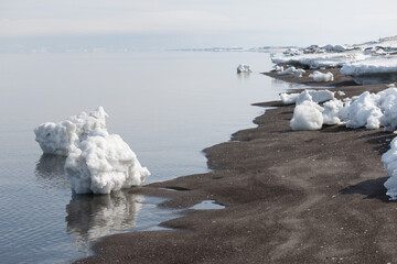 Lumps of sea ice on winter beach © Alexandra Scotcher