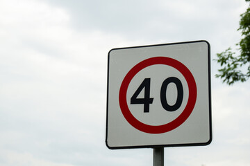 Speed limit sign with blue sky background. European Speed limit sign 40 km per hour. City zone...