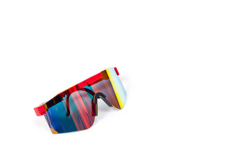 Cycling goggles with reflective lenses in bright rainbow colours.