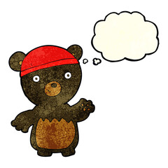 cartoon black bear wearing hat with thought bubble