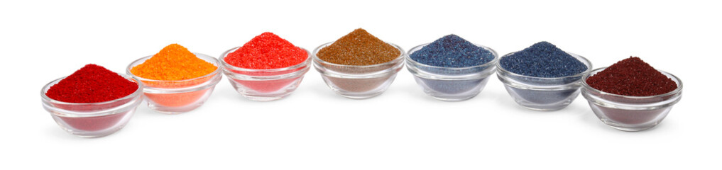 Glass bowls with different food coloring isolated on white