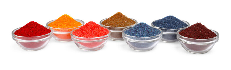 Glass bowls with different food coloring isolated on white