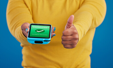 Phone screen, transaction and person thumbs up for payment success in e commerce, online shopping and mobile app. Yes, like and thank you sign of woman with machine and fintech check mark in studio