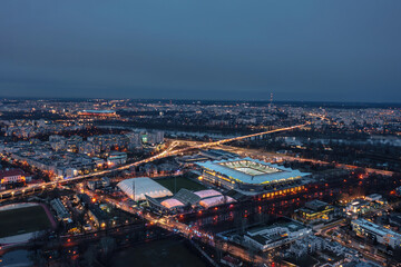 Aerial night skyline cityscape of the illuminated Warsaw, Poland - obrazy, fototapety, plakaty