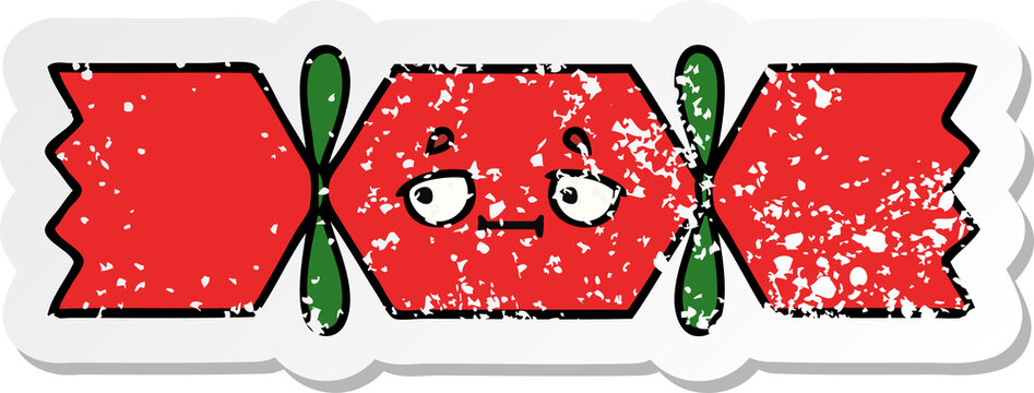 distressed sticker of a cute cartoon christmas cracker