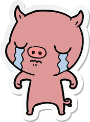 sticker of a cartoon pig crying