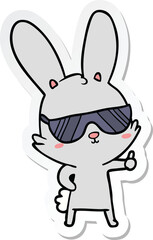 sticker of a cute cartoon rabbit wearing sunglasses