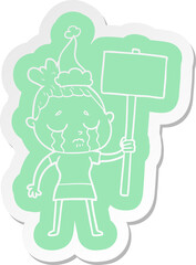 cartoon  sticker of a crying woman with protest sign wearing santa hat