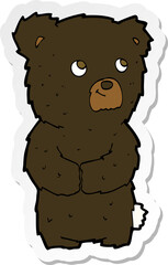 sticker of a cartoon black bear cub