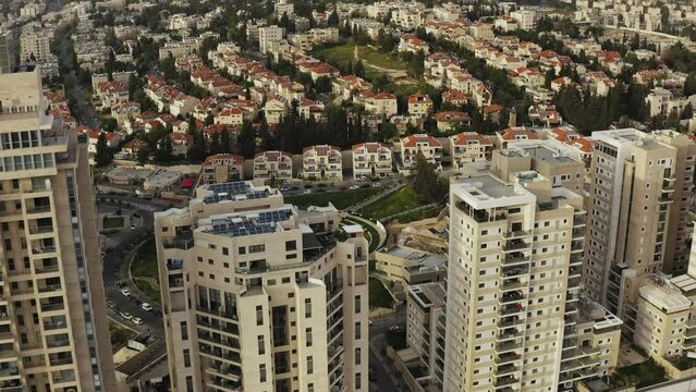 Aerial Drone shot over residential apartment buildings in Jerusalem Israel where families live and have community