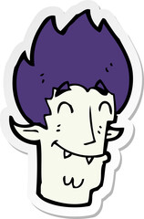 sticker of a cartoon happy vampire head