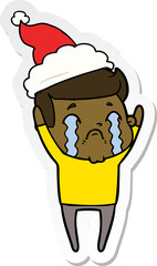sticker cartoon of a man crying wearing santa hat