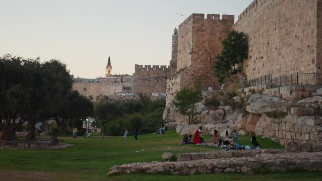 Jewish families playing outside the old city of Jerusalem walls in the holy city Israel
