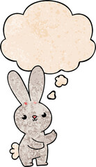 Obraz premium cute cartoon rabbit and thought bubble in grunge texture pattern style