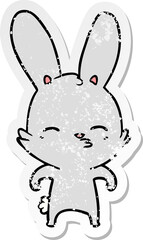 distressed sticker of a curious bunny cartoon