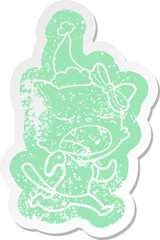 cartoon distressed sticker of a yawning cat wearing santa hat