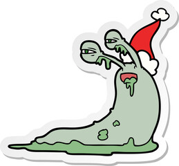 gross sticker cartoon of a slug wearing santa hat