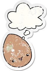 cartoon egg and thought bubble as a distressed worn sticker