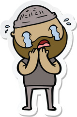 sticker of a cartoon bearded man crying