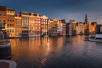 Canals in Amsterdam - the capital of the Netherlands in a night scenery. The huge amount of colors...