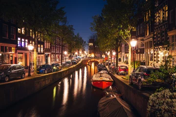 Gardinen Canals in Amsterdam - the capital of the Netherlands in a night scenery. The huge amount of colors adds a beautiful look to this architecture. © PawelUchorczak