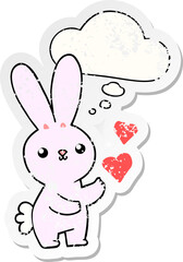 cute cartoon rabbit with love hearts and thought bubble as a distressed worn sticker