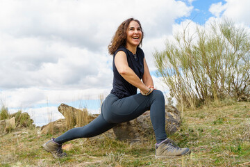 smiling woman finds inner peace through yoga in nature