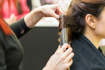 The process of creating hairstyles, hair care. Background, selective focus.