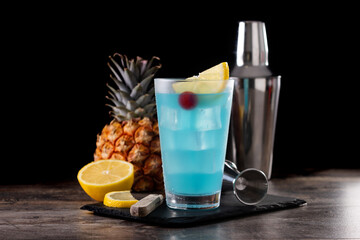 Deep blue sea martini cocktail on wooden table