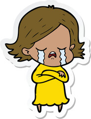 sticker of a cartoon girl crying