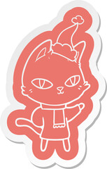 cartoon  sticker of a cat staring wearing santa hat