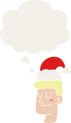 cartoon man wearing christmas hat and thought bubble in retro style