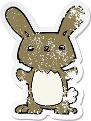distressed sticker of a cute cartoon rabbit