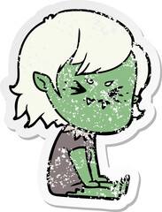 distressed sticker of a annoyed cartoon vampire girl