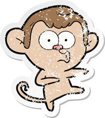 distressed sticker of a cartoon dancing monkey
