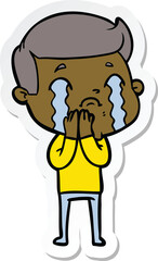 sticker of a cartoon man crying