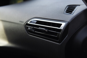  Close-up of the dashboard, adjustment of the blower, air conditioner. Elements of air conditioning and heating in the car. 