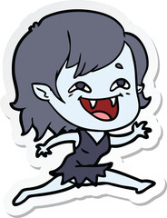 sticker of a cartoon laughing vampire girl