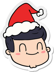 sticker cartoon of a male face wearing santa hat