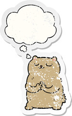 cartoon bear and thought bubble as a distressed worn sticker