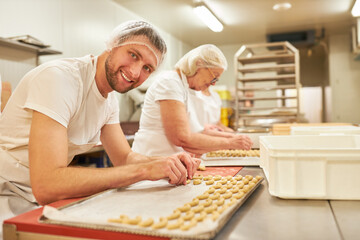 Baker apprentice in training bakes vanilla crescents