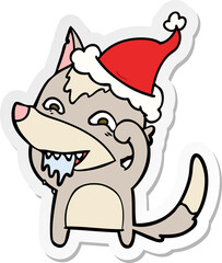 sticker cartoon of a hungry wolf wearing santa hat
