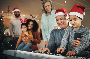 Piano, christmas and elderly man with grandson in a living room, happy and celebration while bonding in their home. Family, music and retired senior man with boy, festive and learning instrument